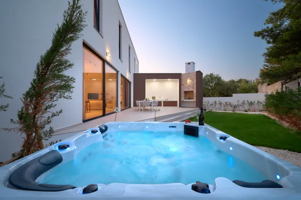 Jacuzzi in garden at evening