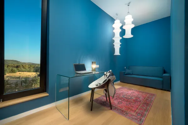 Office with blue glass desk